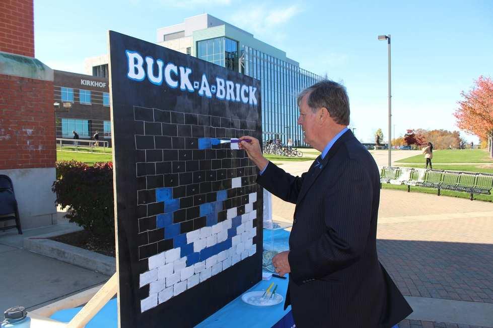 President Thomas Haas supports the Buck-A-Brick Fundraiser